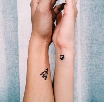 Spaceship and planet tattoo