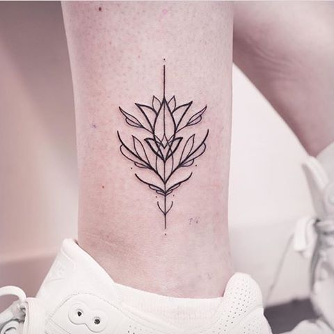 Stylized lotus flower tattoo