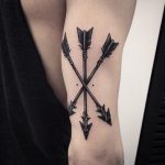 Three arrows tattoo on the arm