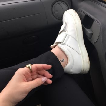Tiny moon tattoo on the ankle