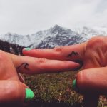 Tiny tattoos on fingers