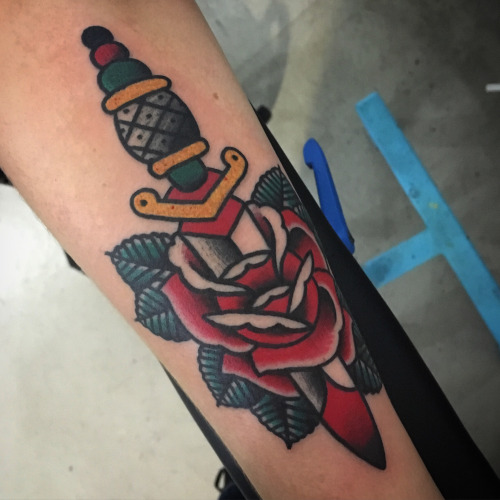 Traditional rose and dagger tattoo