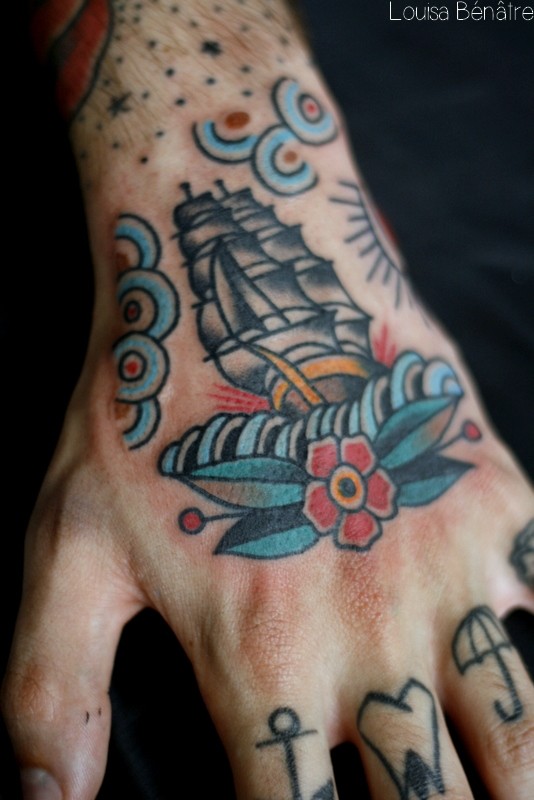 Traditional ship tattoo on the hand
