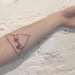 Triangle tattoo on the arm