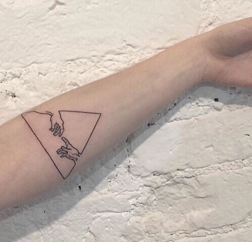 Triangle tattoo on the arm