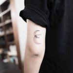 Two crescent moons tattoo
