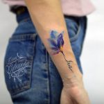Violet flower tattoo