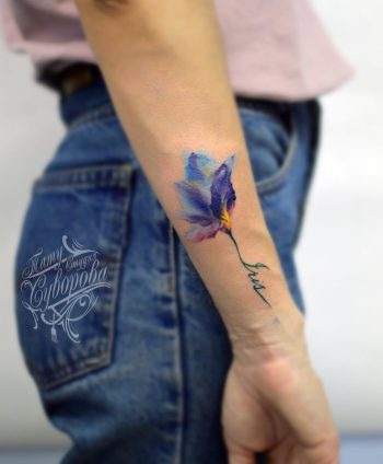 Violet flower tattoo