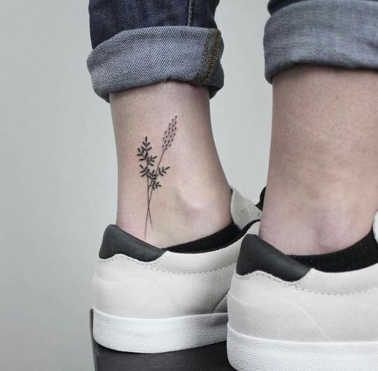 Wildflowers tattoo on the inner ankle 