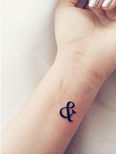 & symbol tattoo on the wrist