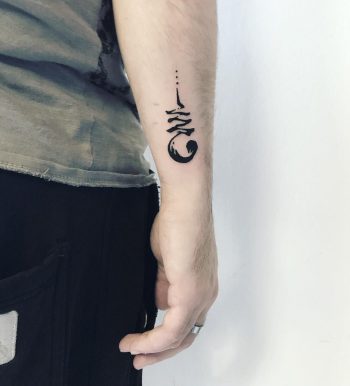 Abstract black forearm tattoo