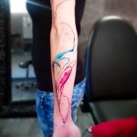Abstract colorful arm tattoo