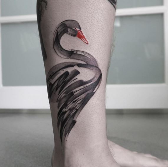 Abstract paintbrush tattoo of a black swan 