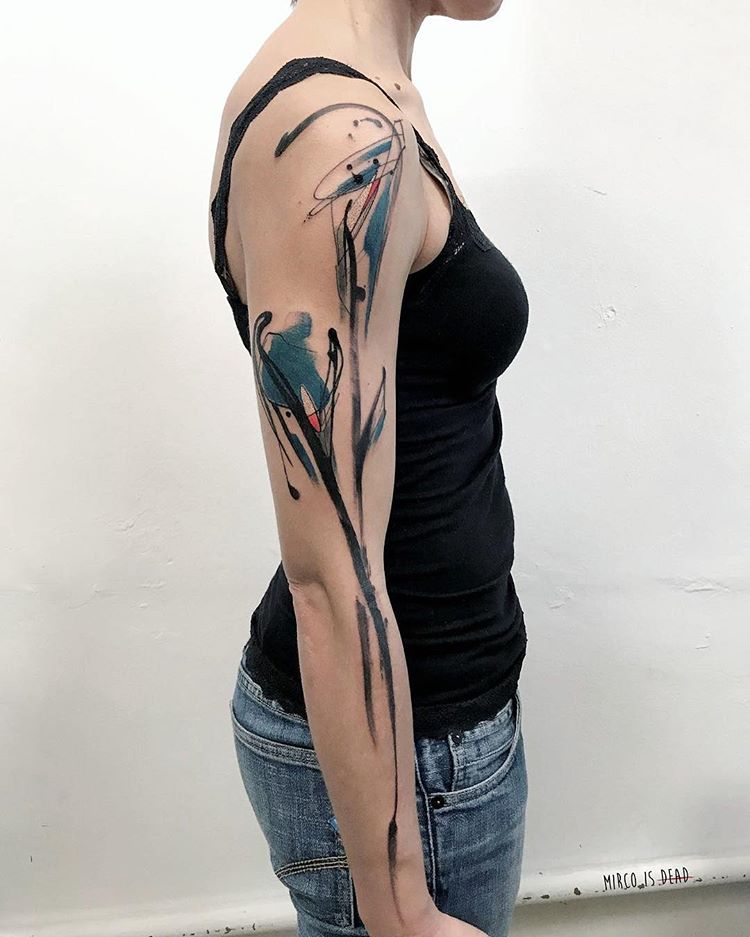 Abstract watercolor arm tattoo