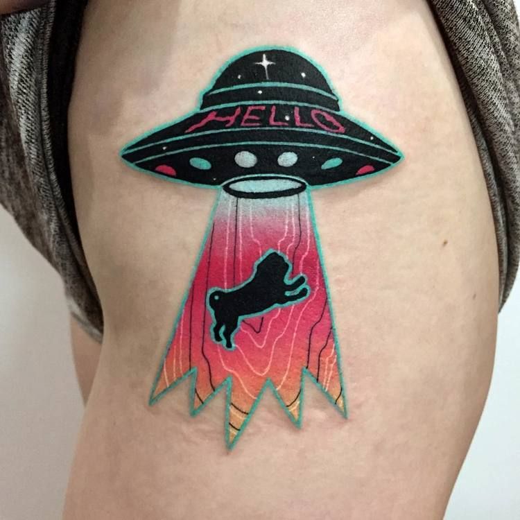 Alien abduction tattoo on the hip