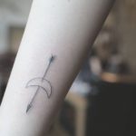Arrow stabbed crescent moon tattoo