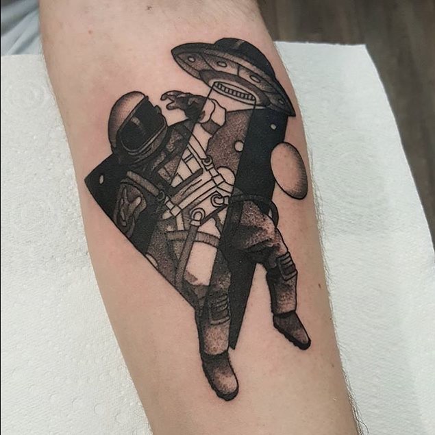 Astronaut and an alien spaceship tattoo