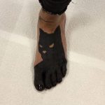 Batman tattoo on the foot