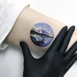 Beautiful circular landscape tattoo