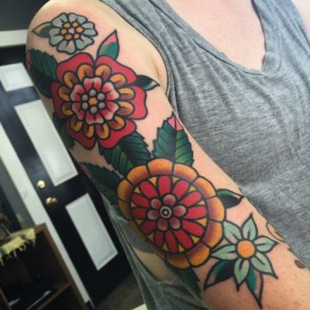 Beautiful traditional flowers sleeve tattoo