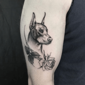 Black dobermann tattoo