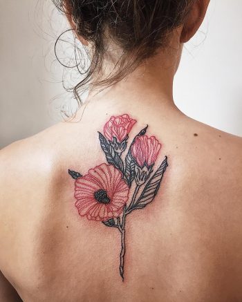 Black and red flower tattoo on the back