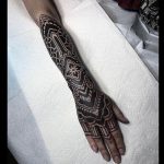 Black and white pattern tattoo on the arm