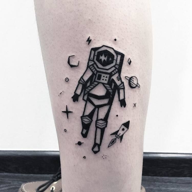 Black astronaut tattoo