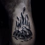 Black campfire tattoo