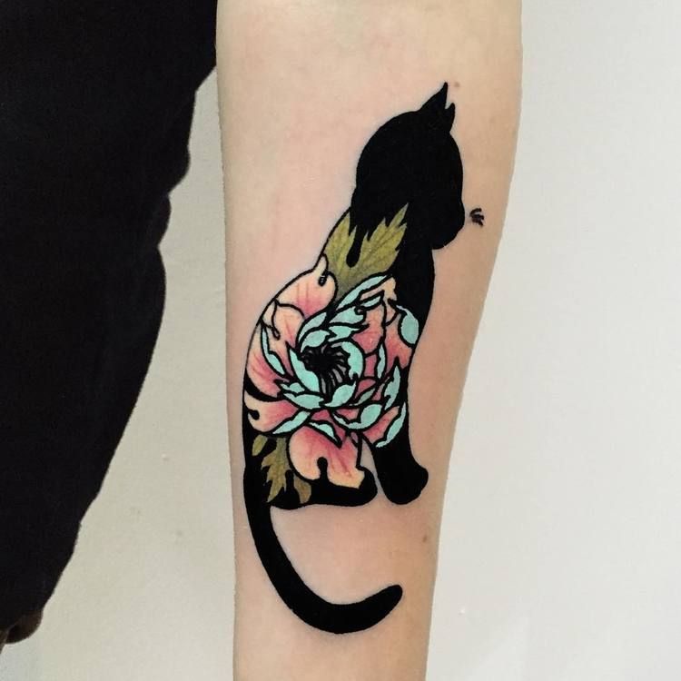 Black cat with flowers tattoo