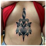 Black dagger and heart tattoo