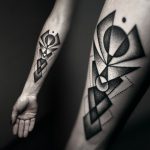 Black dot work style geometric tattoo