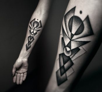 Black dot work style geometric tattoo