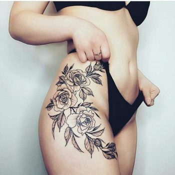 Black flower tattoo on the hip