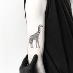 Black giraffe tattoo