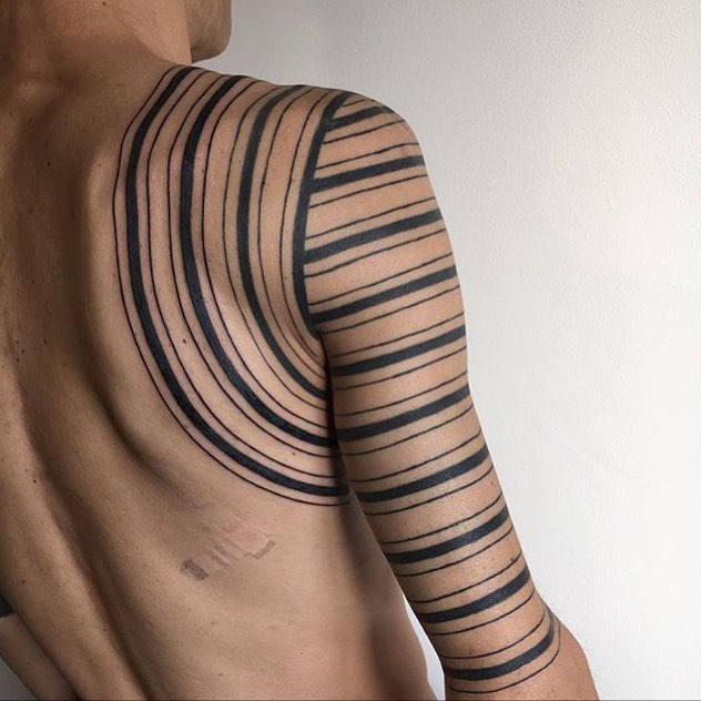 Black linear sleeve tattoo
