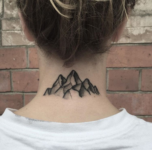 Black mountain tattoo on the back of the neck