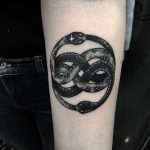 Black ouroboros snake tatto