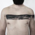 Black paintbrush strok line tattoo