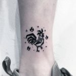 Black rooster tattoo