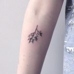 Black small twig with leaves tattoo