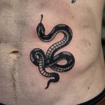 Black snake tattoo on the belly