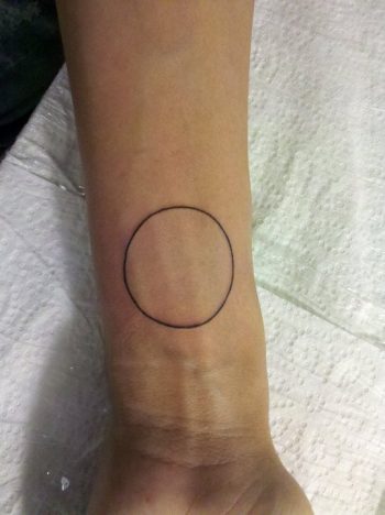Black thin circle tattoo