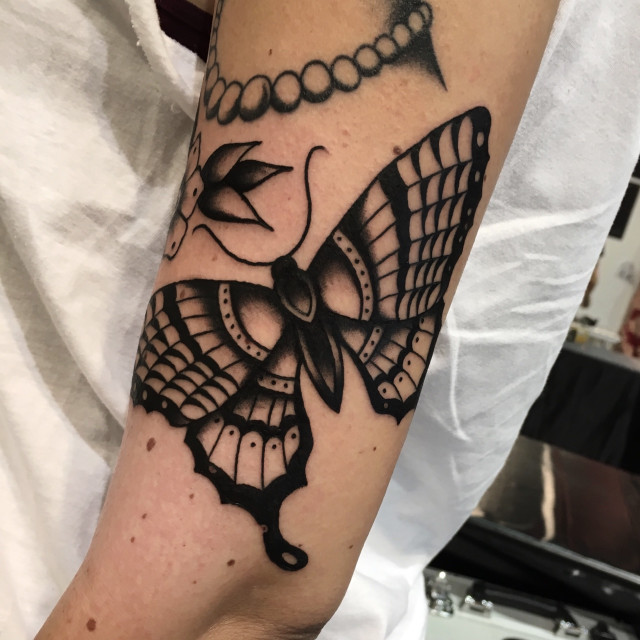 Black traditional butterfly tattoo