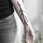 Black tree branch tattoo