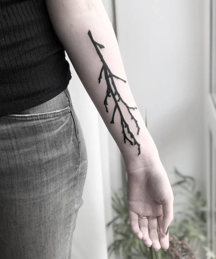 Black tree branch tattoo