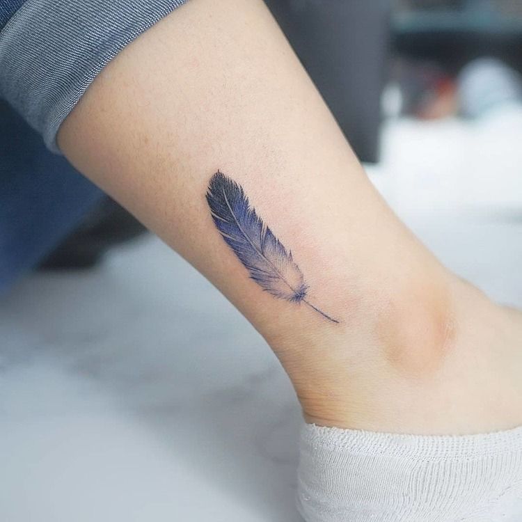 Blue feather tattoo on the ankle - Tattoogrid.net