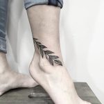 Branch with leaves tattoo on the ankle