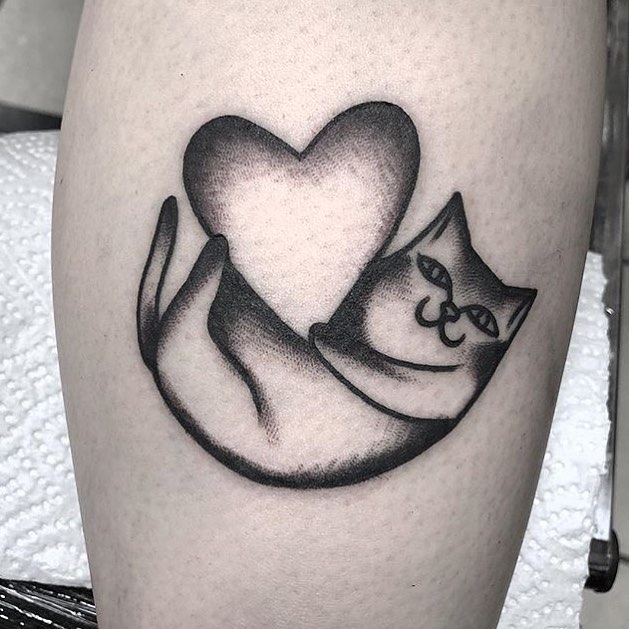 Cat with a heart tattoo