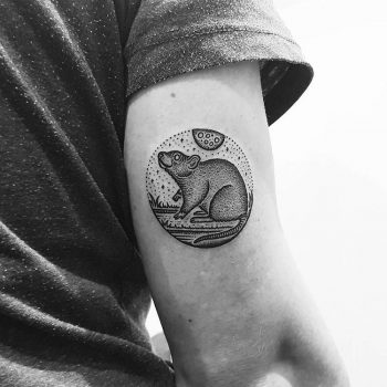 Circular opossum tattoo